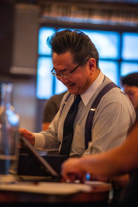 Ueno serving cocktails at the Atlas event