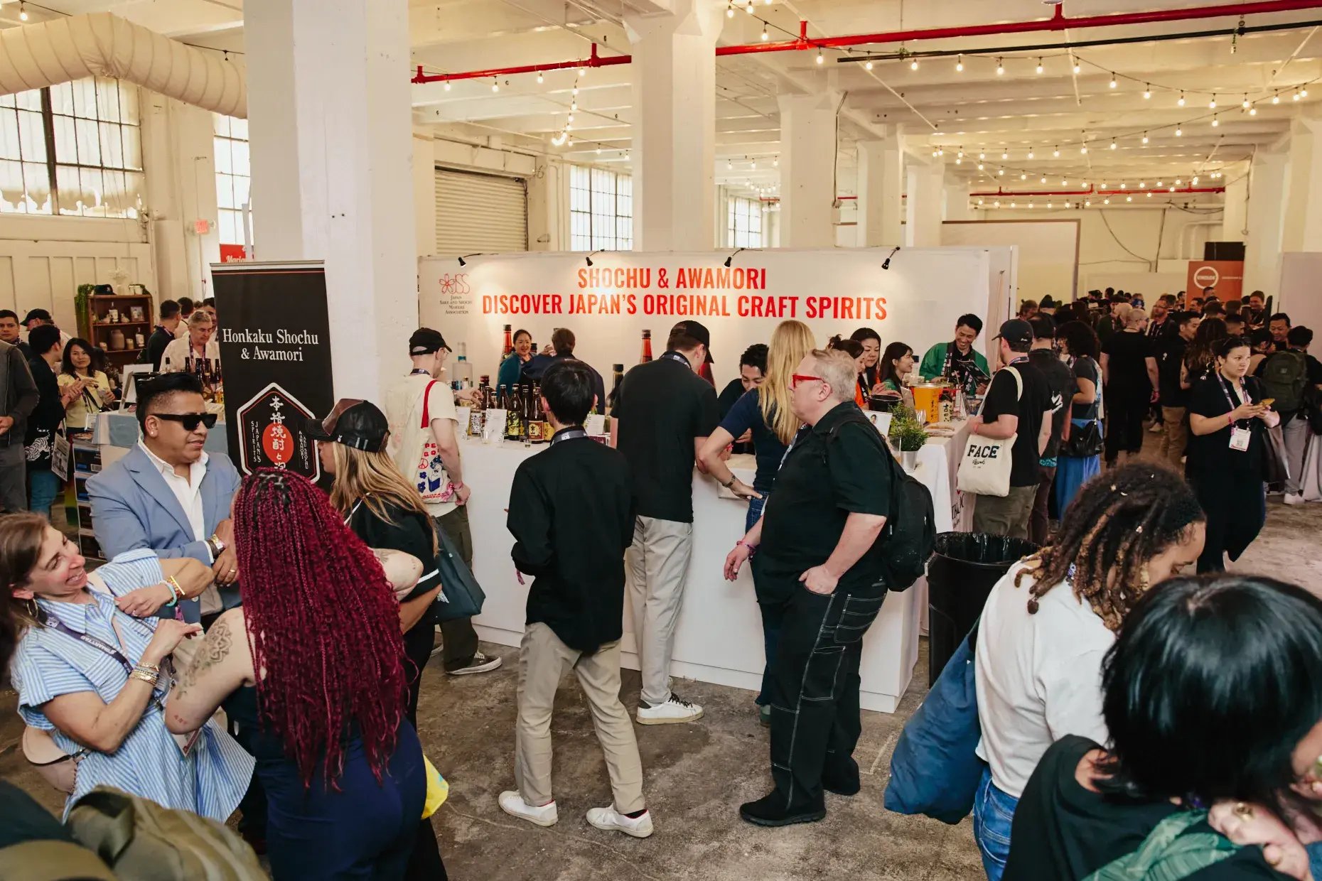 A booth serving honkaku shochu set up inside the venue