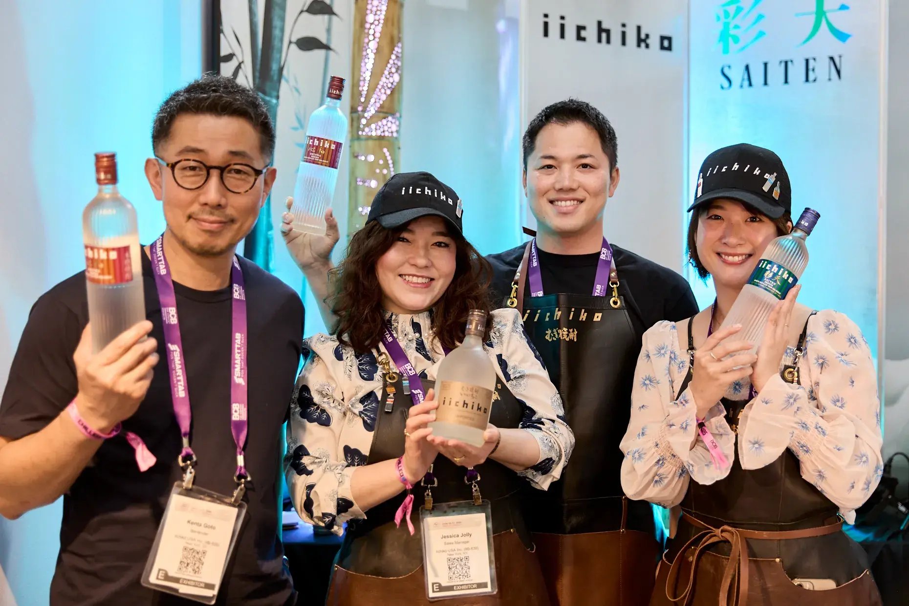 Kenta Goto (left) in front of the iichiko booth. Second from the right: Tsutomu Higashi, Team Leader of iichiko USA.