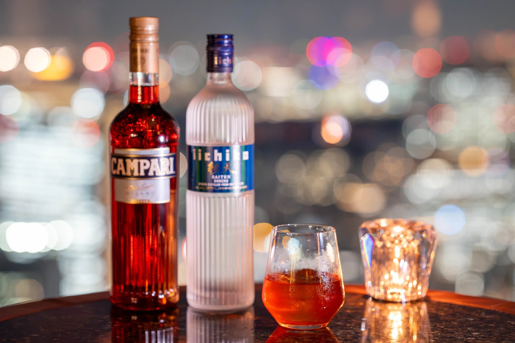 Shingo Gokan’s Bincho Negroni — made with iichiko Saiten, Campari, passion fruit, and bincho charcoal-grilled schmaltz